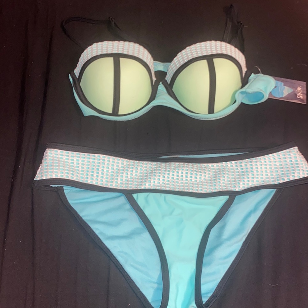 Matching girls swimsuit! It is green and teal and a padded top! NEVER BEEN WORN!